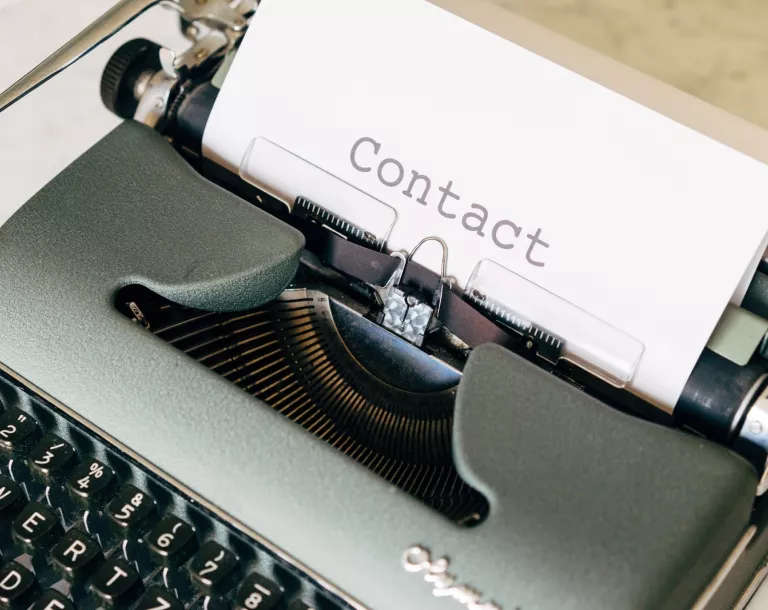 Contact page - typewriter with a paper that contains the word contact